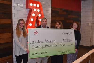 Members of Junior Achievement of the Eastern Shore and Arby's pose with a $20,000 grant awarded to JAES.